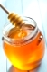 honey dipper and honey in jar