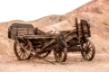 Old wooden broken wagon in calico ghost town, USA