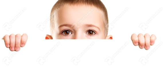 Little scared or worried child boy holding blank white sign or placard hiding face