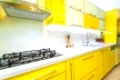 Modern design kitchen with yellow and green elements