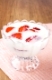 Fresh yogurt with strawberry slices in glass bowl