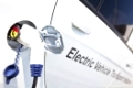 Electric charging noozle inserted into electrical vehicle's charging plug
