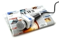 News or journalism concept. Microphone on the newspaper isolated on white. 3d