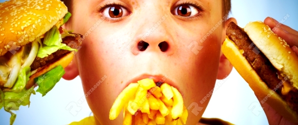 boy with meal in a mouth