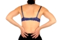 Junge schlanke Frau hat RückenschmerzenYoung slim female has backache