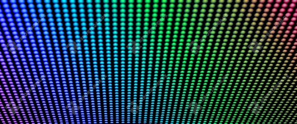 Arrays of LED bulbs on a surface of a contemporary indoor video display. Shallow depth of field.