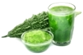 Herbal juice of green momodica in glass over white background
