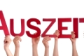 Many Caucasian People And Hands Holding Red Straight Letters Or Characters Building The Isolated German Word Auszeit Which Means Downtime On White Background