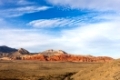 Western landscape showing the Red Rock Canyon hills rising from the desert floor in southern Nevada.  Copy space in the sky if needed.