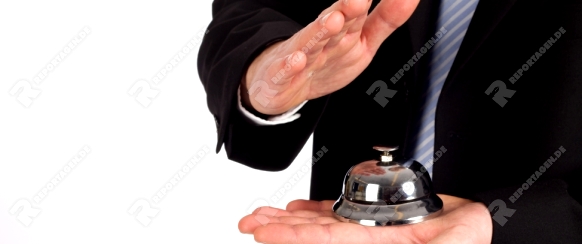 Businessman with a bell