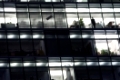 facade of a modern office building with the shadow of a business man