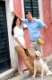 Modern couple with Labrador dog in the city