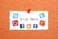 Social Media concept note paper pinned on cork board.