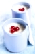 Homemade Greek yogurt with cranberries in two ceramic jars
