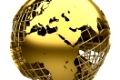 Stylized golden globe of the Earth with a grid of meridians and parallels