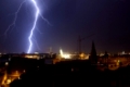 Lightning bolts during thunderstorm in the city