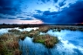 dark storm clouds over lake at sunset, Fochteloerveen