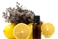 Essential oil of lemon and lavender on white background