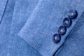 tailor background - fragment of blue silk men's suit close up