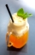 glass of Ice mango tea with mint