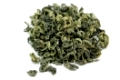 dried green tea leaves on white