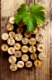 Dated wine bottle corks on the wooden background. Close up